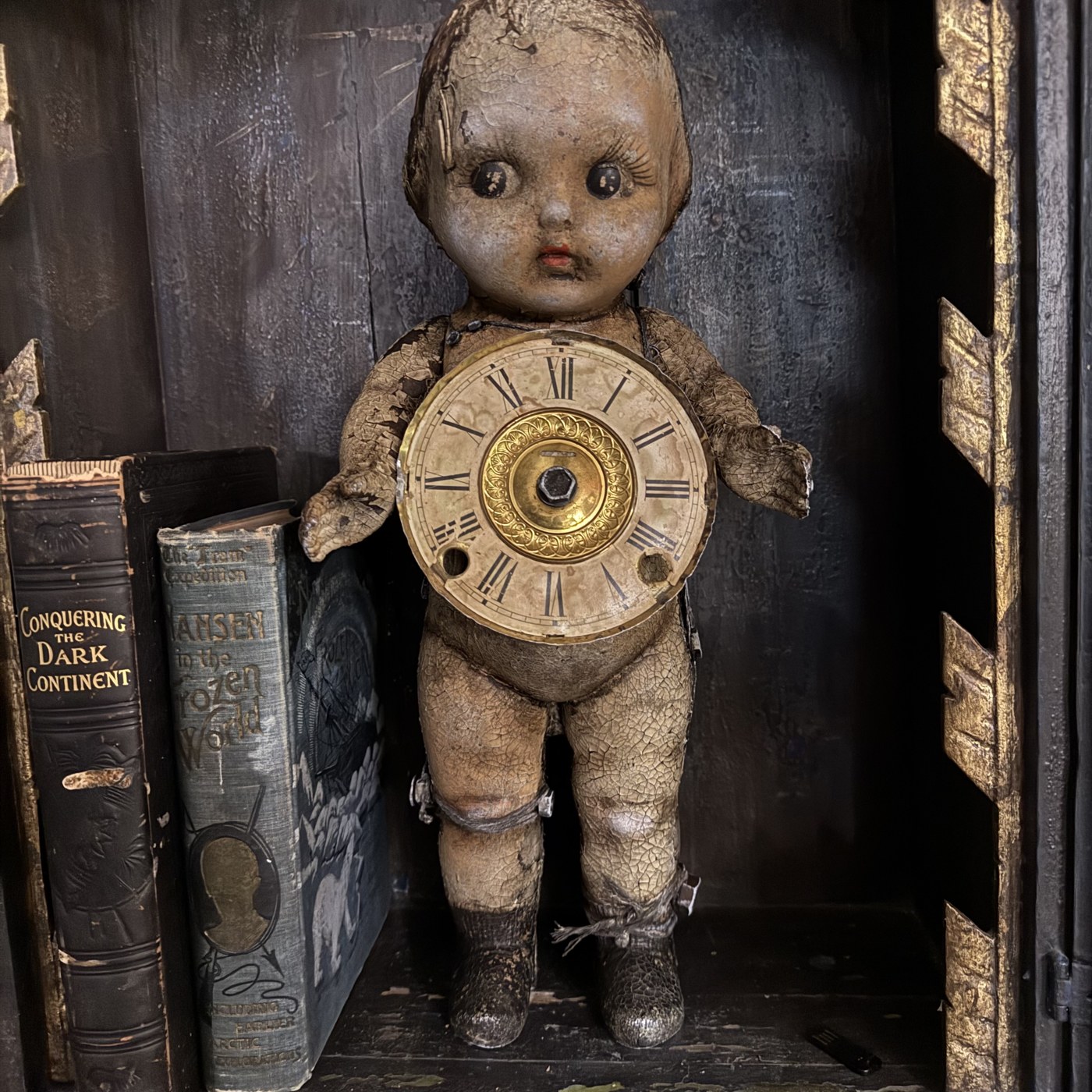 Antique doll with clock face assemblage