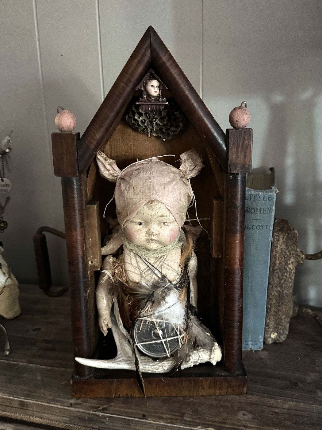 Doll shrine in a wooden house niche
